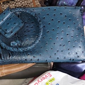 Ostrich croc handcuff clutch